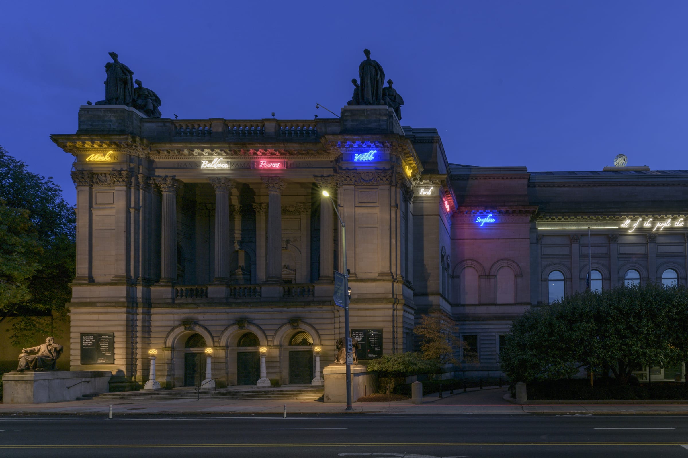 Neon text by Tavares Strachan on the exterior of the Carnegie Museum of Art